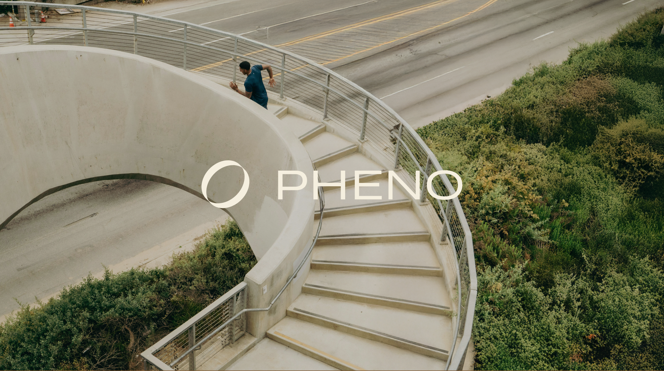 Pheno brand logo on a spiral staircase, symbolizing holistic health and balance in wellness strategy.